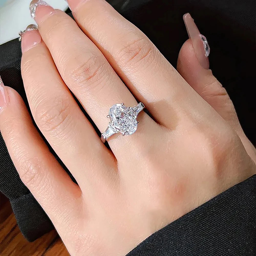 Oval Cut Moissanite 3-Stone Ring | Tapered Side Stones | 3CT / 4.5CT / 8CT | Certified | 925 Silver Platinum Plated