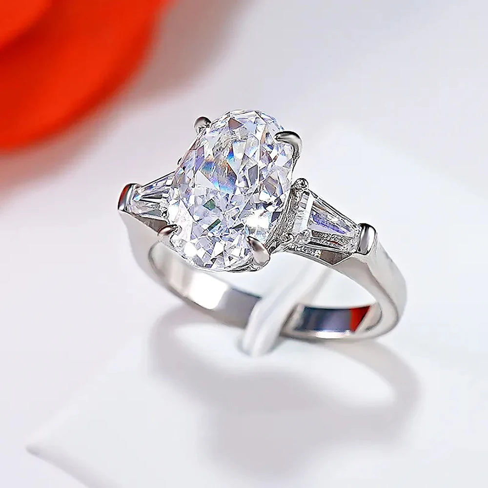 Oval Cut Moissanite 3-Stone Ring | Tapered Side Stones | 3CT / 4.5CT / 8CT | Certified | 925 Silver Platinum Plated