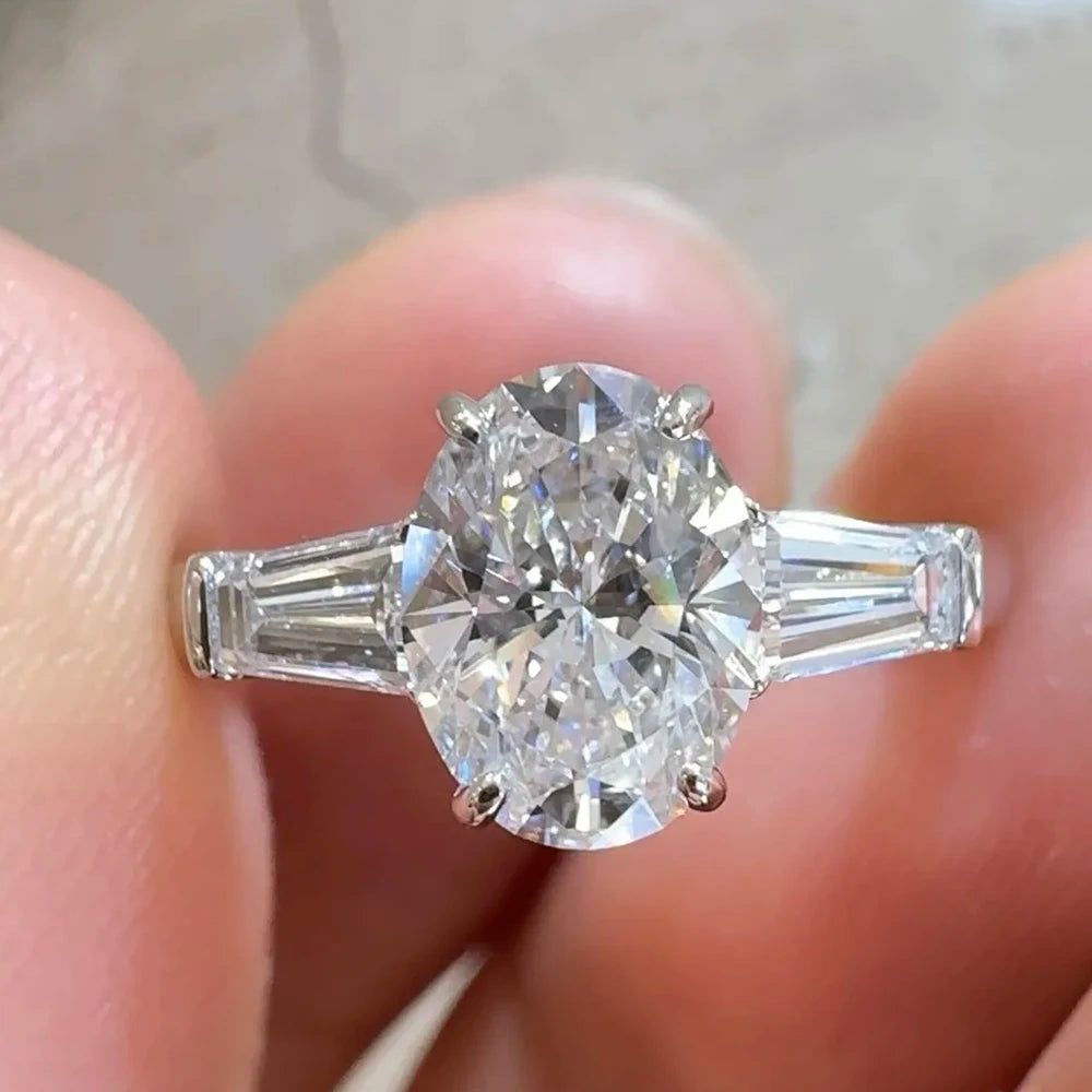Oval Cut Moissanite 3-Stone Ring | Tapered Side Stones | 3CT / 4.5CT / 8CT | Certified | 925 Silver Platinum Plated