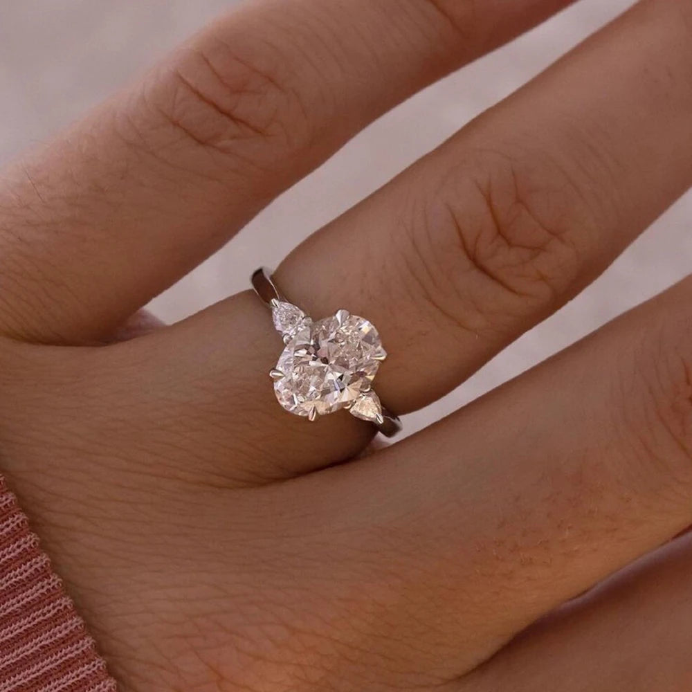 Oval Cut Moissanite 3-Stone Ring | Pear Side Stones | 3CT / 8CT Total | 925 Sterling Silver